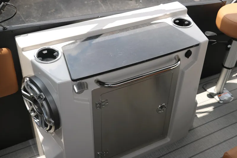 Slide: The Image of 2026 Sylvan G3 DLZ Bar boat interior with speaker and storage compartment. - 25