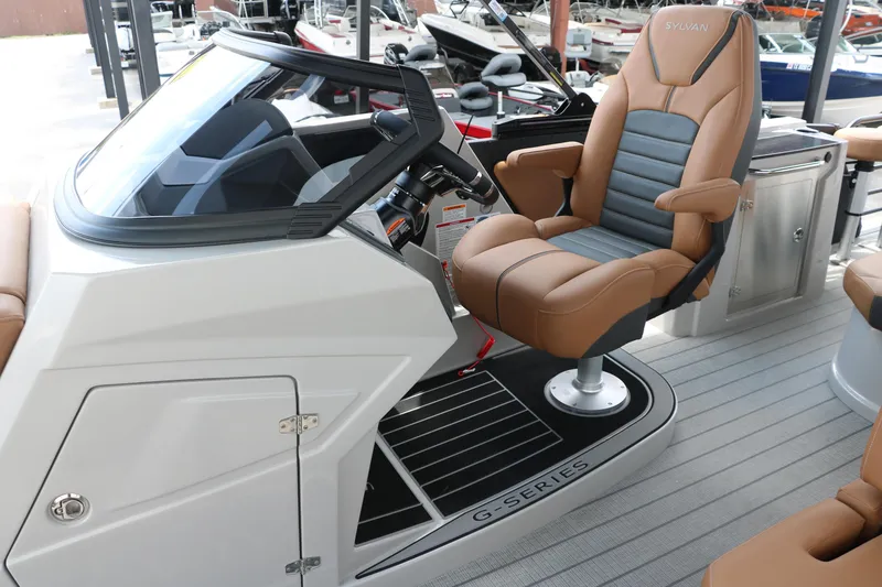 Slide: The Image of 2026 Sylvan G3 DLZ Bar boat with luxurious captain's chair and sleek dashboard design. - 30