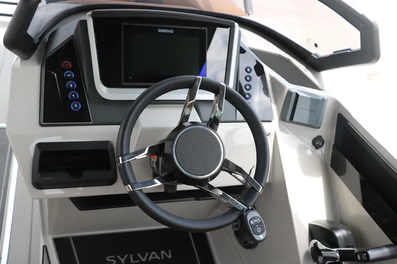 Slide: The Image of Steering console of 2026 Sylvan G3 DLZ Bar boat with modern controls and display. - 31