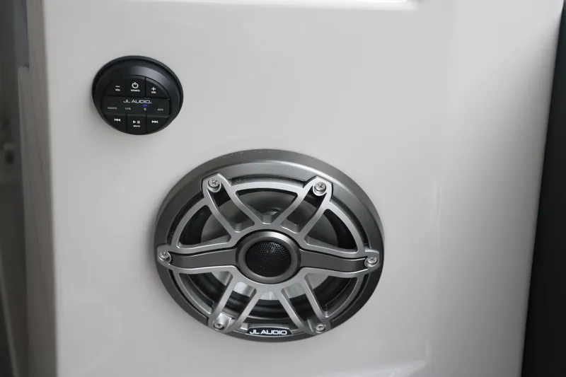 Slide: The Image of JL Audio speaker and control panel on 2026 Sylvan G3 DLZ Bar boat. - 33