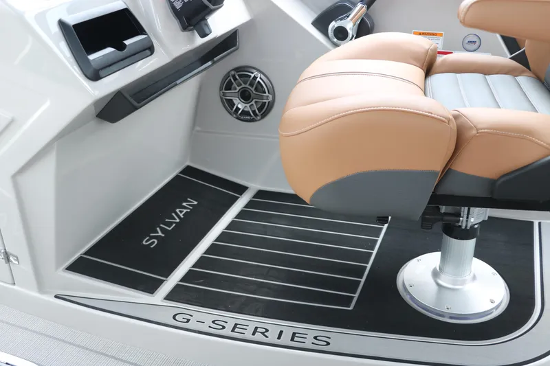 Slide: The Image of 2026 Sylvan G3 DLZ Bar boat interior with tan seat and sleek dashboard design. - 34