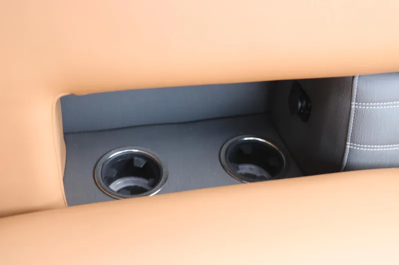 Slide: The Image of 2026 Sylvan G3 DLZ Bar interior with dual cup holders and tan upholstery. - 36