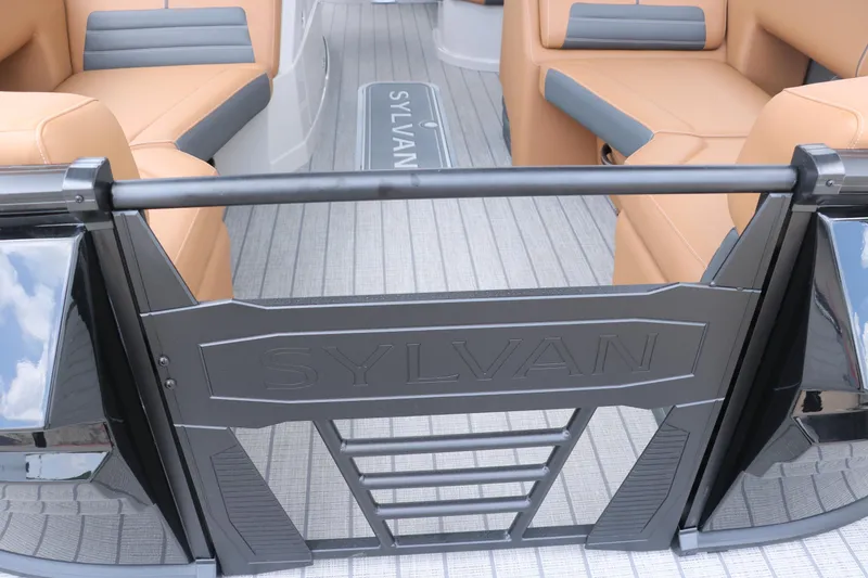 Slide: The Image of 2026 Sylvan G3 DLZ Bar boat interior with tan seating and branded gate. - 39