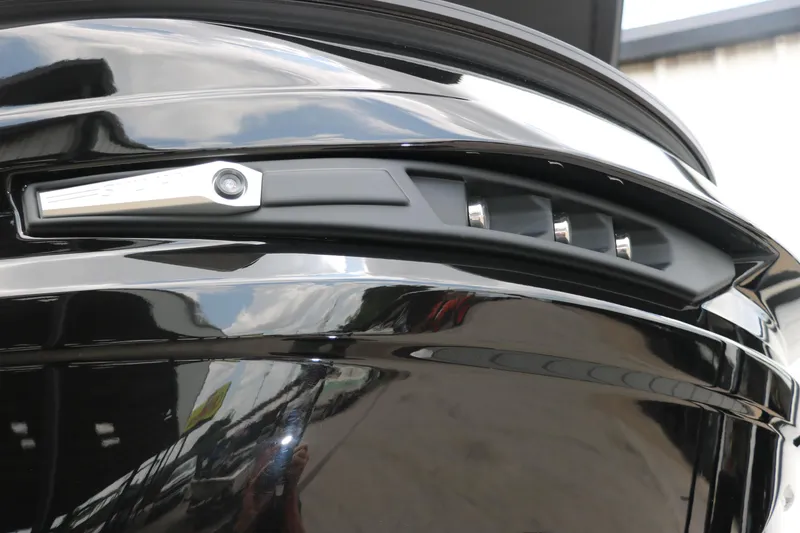 Slide: The Image of Close-up of 2026 Sylvan G3 DLZ Bar boat's sleek black exterior design. - 40
