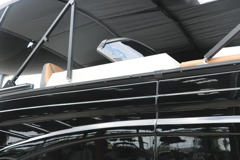 Slide: The Image of 2026 Sylvan G3 DLZ Bar boat with sleek black exterior and modern design elements. - 41