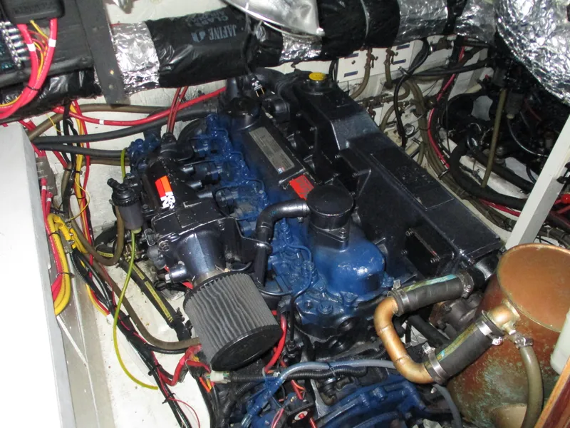 Slide: The Image of Engine compartment of a 1989 Bayliner 3888 boat, showcasing intricate wiring and components. - 43