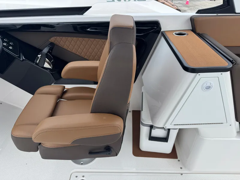 Slide: The Image of 2025 Yamaha Boats 252SD interior with tan seating and modern console design. - 22