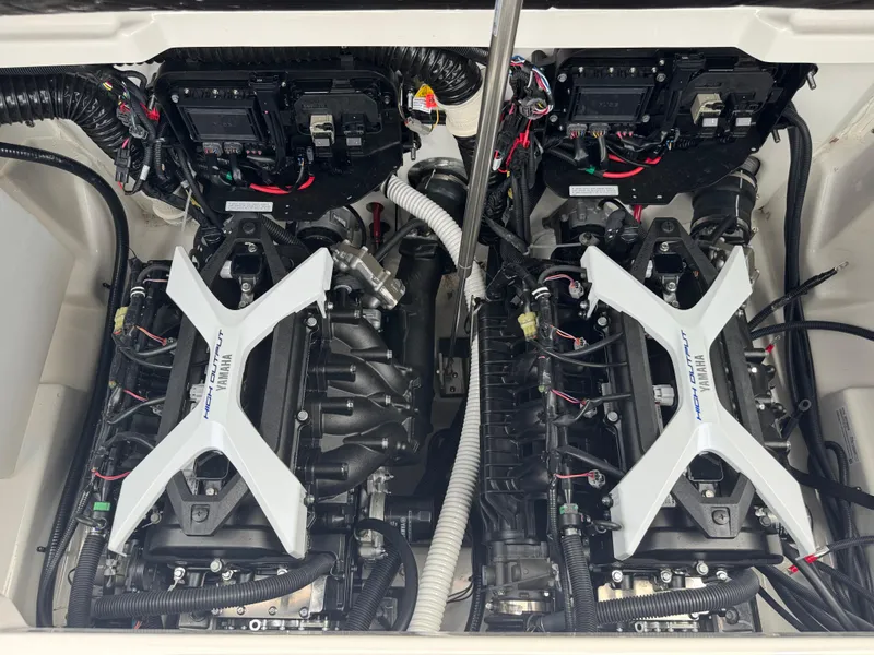 Slide: The Image of Engine compartment of 2025 Yamaha Boats 252SD, showcasing dual high-output engines. - 29