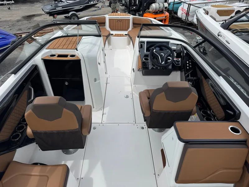 Slide: The Image of 2025 Yamaha Boats 252SD interior with modern seating and sleek dashboard design. - 7