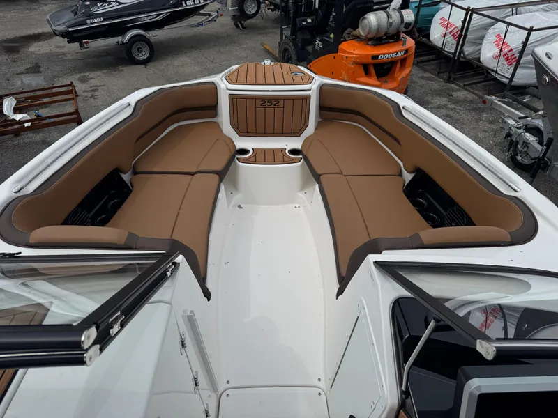 Slide: The Image of 2025 Yamaha Boats 252SD interior with tan seating and sleek design. - 9
