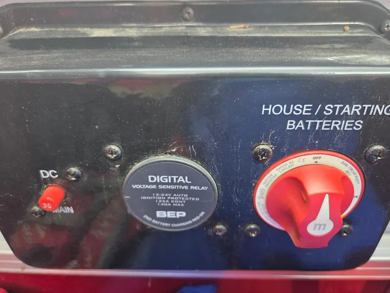 Slide: The Image of Control panel of a 2017 South Bay 523 CR with battery switches and voltage relay. - 8