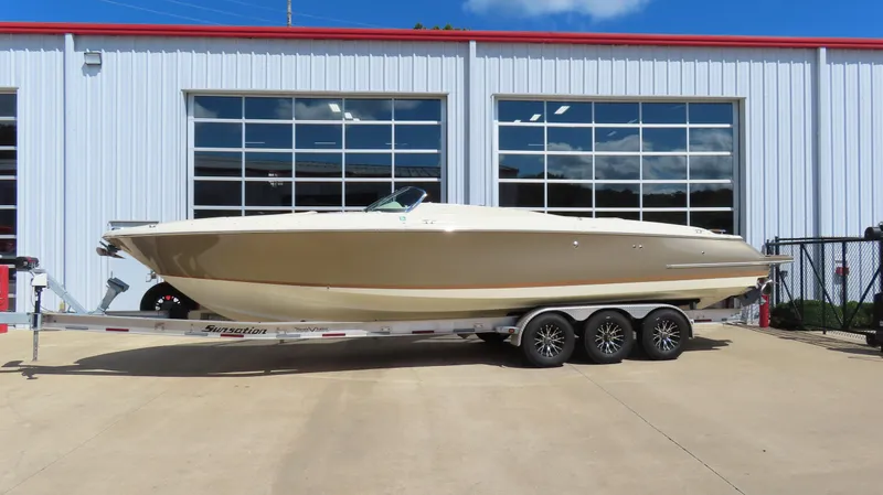 Slide: The Image of 2018 Chris-Craft Launch 34 boat on trailer, parked outside a building. - 0