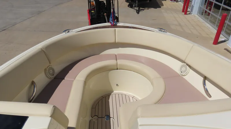 Slide: The Image of 2018 Chris-Craft Launch 34 boat interior with beige seating and wood flooring. - 21