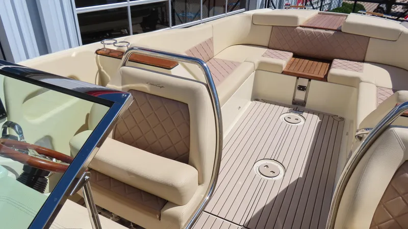 Slide: The Image of 2018 Chris-Craft Launch 34 interior with luxurious seating and elegant wood accents. - 22