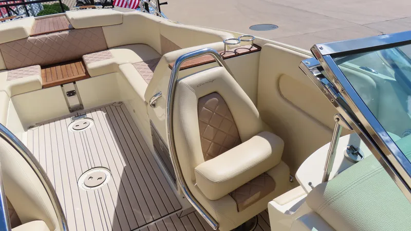 Slide: The Image of 2018 Chris-Craft Launch 34 interior with beige seating and wood accents. - 23