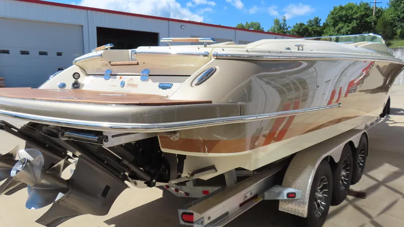 Slide: The Image of 2018 Chris-Craft Launch 34 boat on trailer, showcasing sleek design and polished finish. - 6