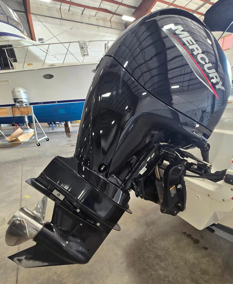 Slide: The Image of 2023 Bayliner VR4 Bowrider OB with Mercury outboard motor in a boatyard. - 10