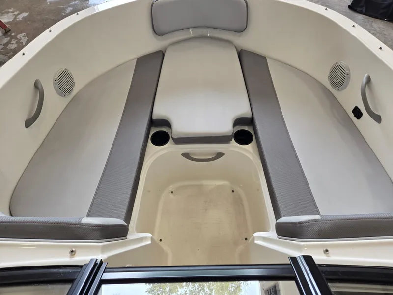 Slide: The Image of 2023 Bayliner VR4 Bowrider OB interior with gray seating and cup holders. - 7