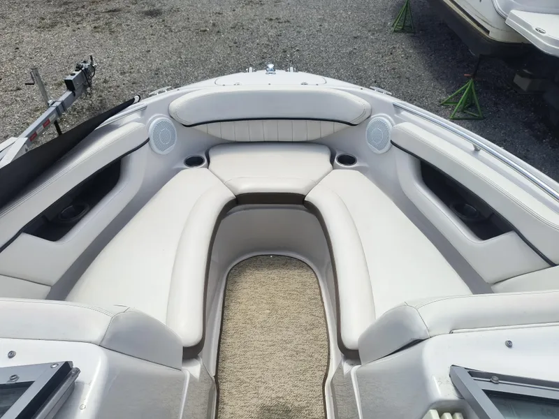 Slide: The Image of 2007 Four Winns 240 Horizon boat interior with white seating and carpeted floor. - 10