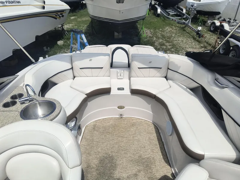 Slide: The Image of 2007 Four Winns 240 Horizon boat interior with plush seating and built-in sink. - 6