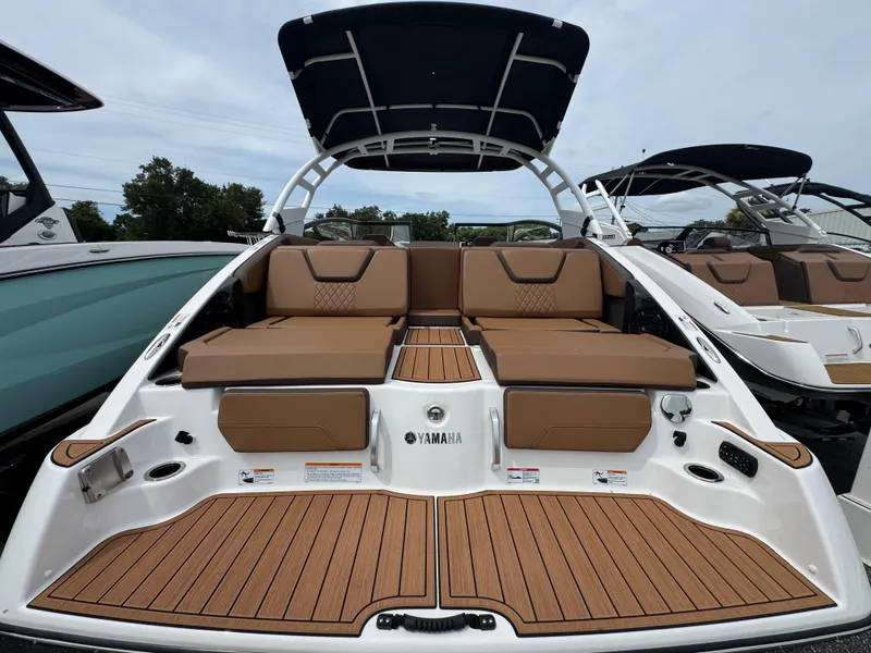 Slide: The Image of 2025 Yamaha Boats 252SD with spacious seating and sleek design. - 2