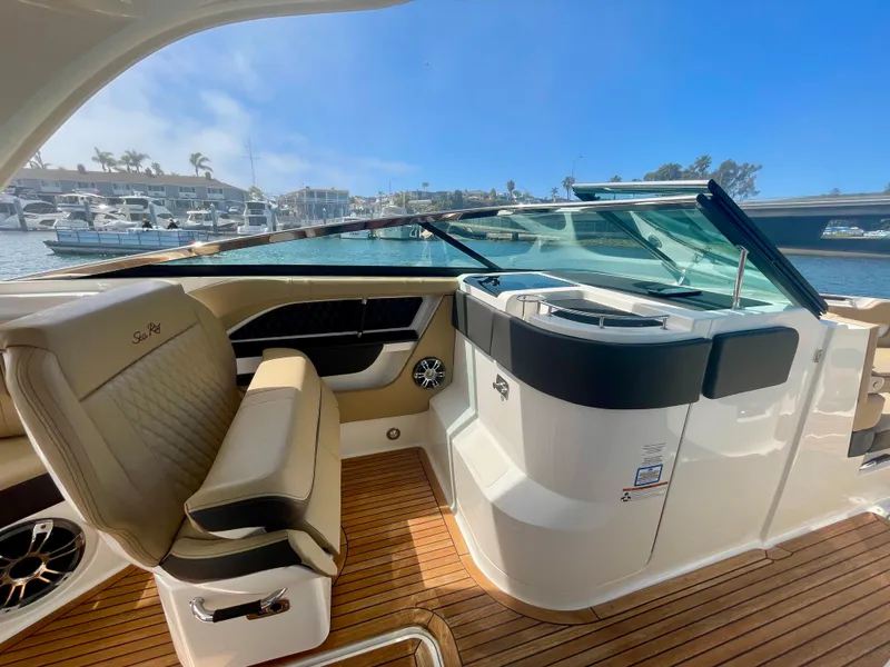 Slide: The Image of 2019 Sea Ray SLX 310 boat interior with luxurious seating and sleek design. - 22