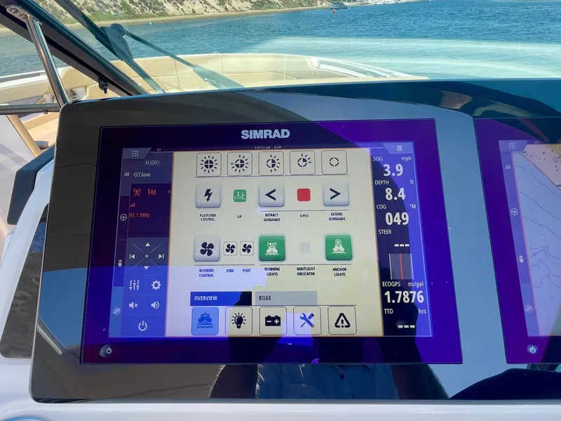 Slide: The Image of Simrad display on 2019 Sea Ray SLX 310 boat, showing navigation and control interface. - 37