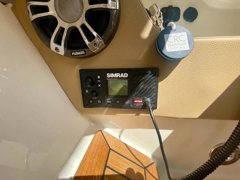 Slide: The Image of Simrad marine electronics and Fusion speaker on 2019 Sea Ray SLX 310 boat. - 40