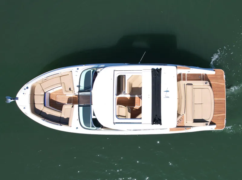 Slide: The Image of Overhead view of 2019 Sea Ray SLX 310 boat on water. - 8