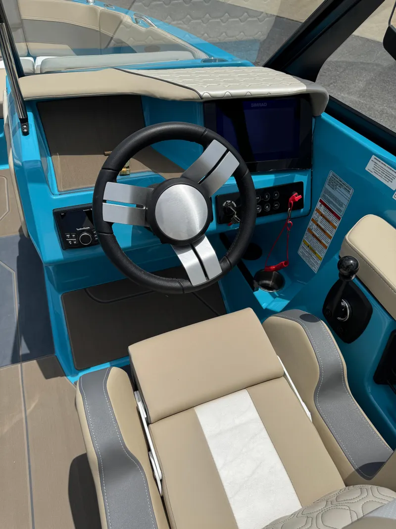 Slide: The Image of 2025 Heyday H22 boat cockpit with modern steering wheel and control panel. - 7