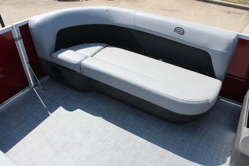 Slide: The Image of 2026 Sun Tracker Party Barge 16 DLX interior with gray seating and red accents. - 10