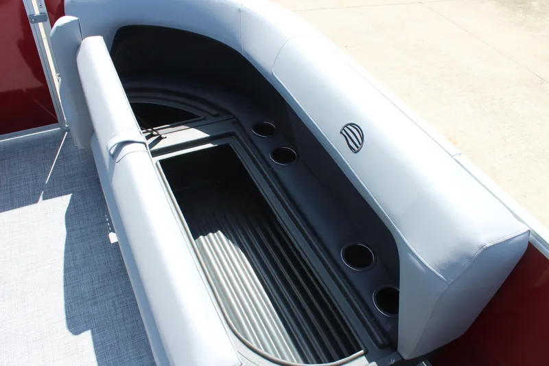 Slide: The Image of 2026 Sun Tracker Party Barge 16 DLX interior seating with cup holders and storage. - 19