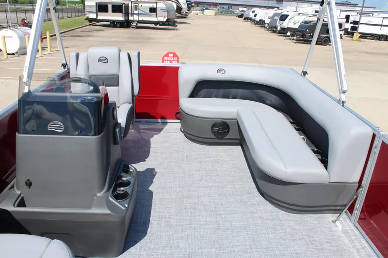Slide: The Image of 2026 Sun Tracker Party Barge 16 DLX interior with gray seating and red accents. - 21