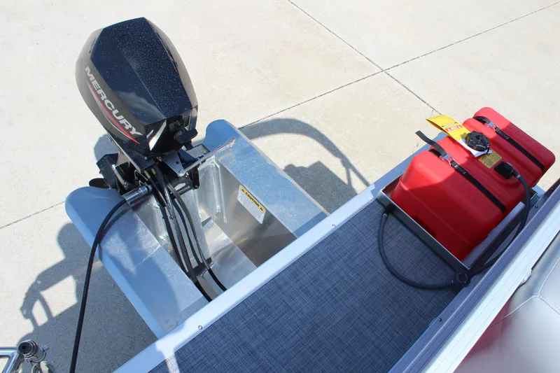 Slide: The Image of 2026 Sun Tracker Party Barge 16 DLX with Mercury outboard motor and red fuel tanks. - 22