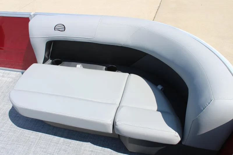Slide: The Image of 2026 Sun Tracker Party Barge 16 DLX, gray seating with cup holders, red paneling. - 9