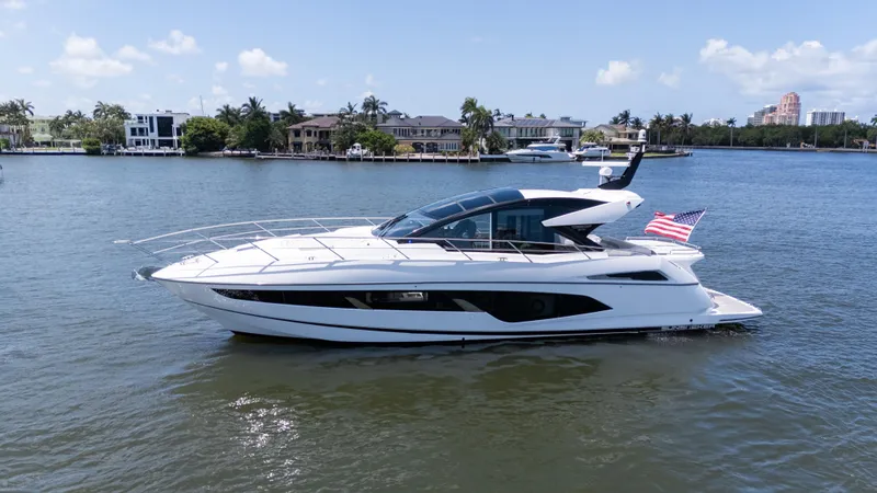 The Image of 2022 Sunseeker Predator 60 yacht cruising on a sunny day, displaying sleek design and luxury. - 0