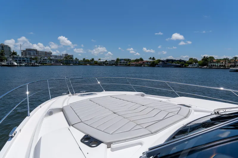 Slide: The Image of Sunseeker Predator 60 yacht, 2022 model, cruising on a sunny day with waterfront views. - 11