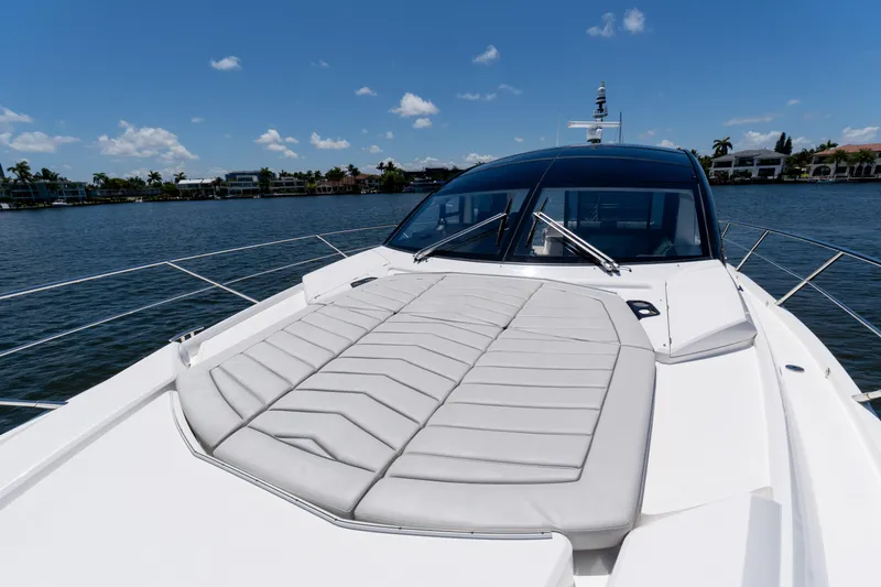 Slide: The Image of 2022 Sunseeker Predator 60 yacht with sunbed, cruising on a sunny day. - 14