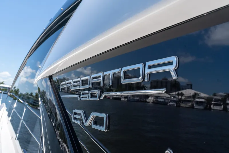 Slide: The Image of 2022 Sunseeker Predator 60 yacht with sleek design and reflective surface. - 16