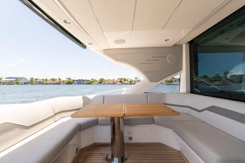 Slide: The Image of Luxurious Sunseeker Predator 60 yacht interior with elegant seating and wooden table, 2022 model. - 21