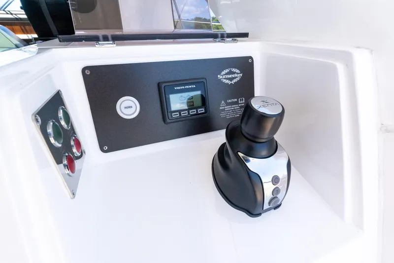 Slide: The Image of Control panel of 2022 Sunseeker Predator 60 yacht with joystick and display. - 28