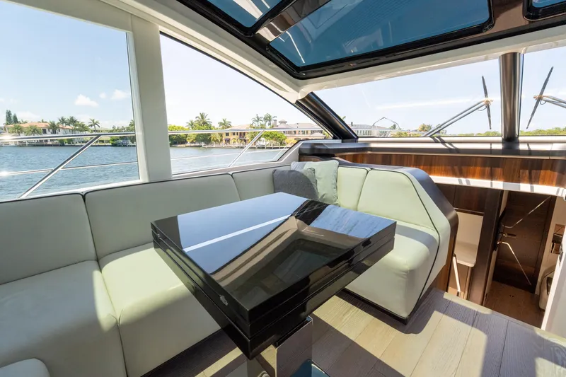 Slide: The Image of Luxurious interior of 2022 Sunseeker Predator 60 yacht with sleek seating and waterfront view. - 33