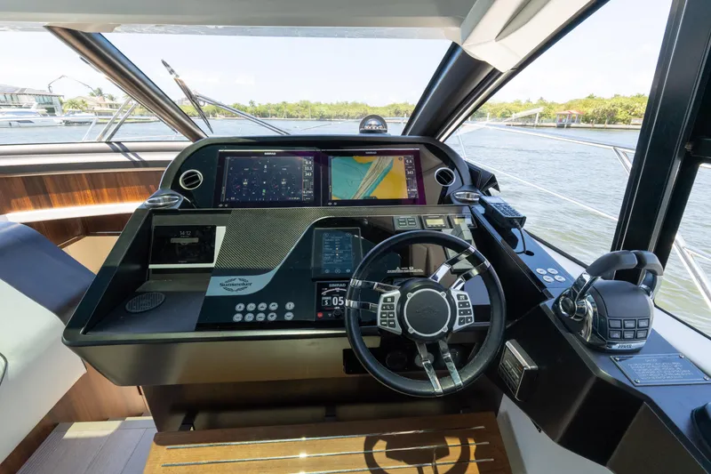 Slide: The Image of Cockpit of 2022 Sunseeker Predator 60 yacht with advanced navigation systems. - 37