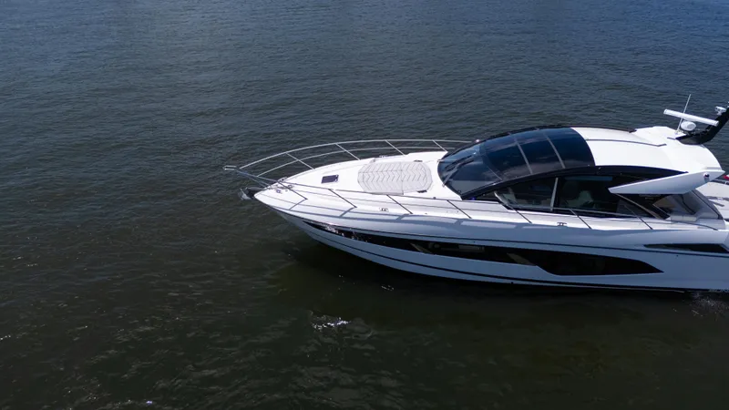 Slide: The Image of 2022 Sunseeker Predator 60 yacht cruising on open water. - 4