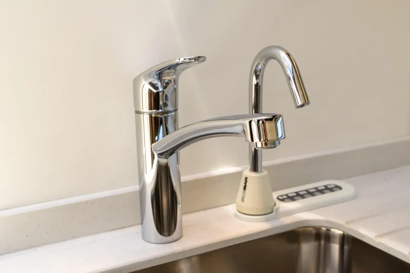Slide: The Image of Modern chrome faucets in a Sunseeker Predator 60 yacht kitchen, 2022 model. - 42