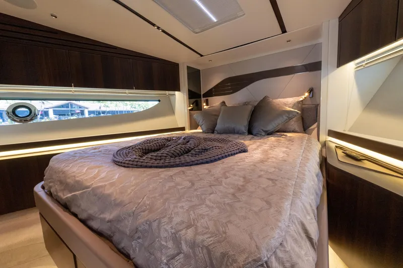 Slide: The Image of Luxurious bedroom interior of 2022 Sunseeker Predator 60 yacht with elegant bedding and modern design. - 45