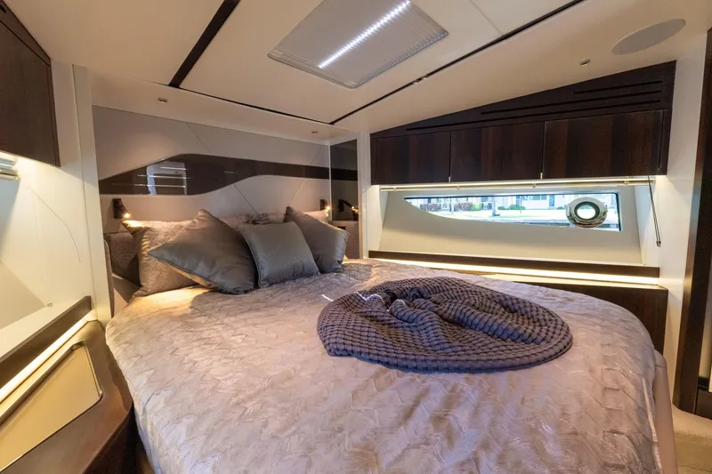 Slide: The Image of Luxurious bedroom interior of 2022 Sunseeker Predator 60 yacht with elegant bedding and modern design. - 46