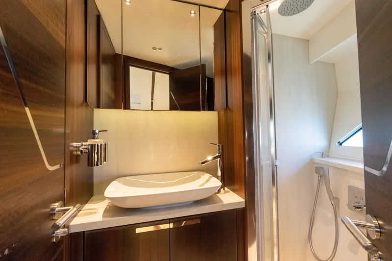 Slide: The Image of Luxurious bathroom in 2022 Sunseeker Predator 60 yacht with modern fixtures and elegant design. - 47