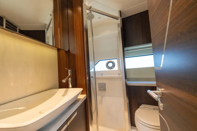Slide: The Image of Luxurious bathroom in 2022 Sunseeker Predator 60 yacht, featuring modern fixtures and elegant design. - 48
