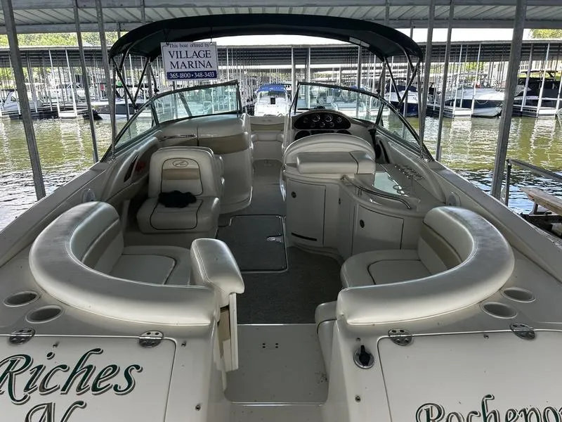 Slide: The Image of 2002 Sea Ray 290 boat interior with seating, docked at Village Marina. - 10